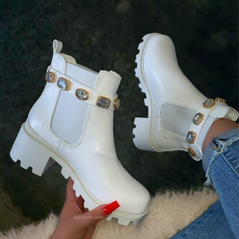 white ankle boots with studded belt buckle